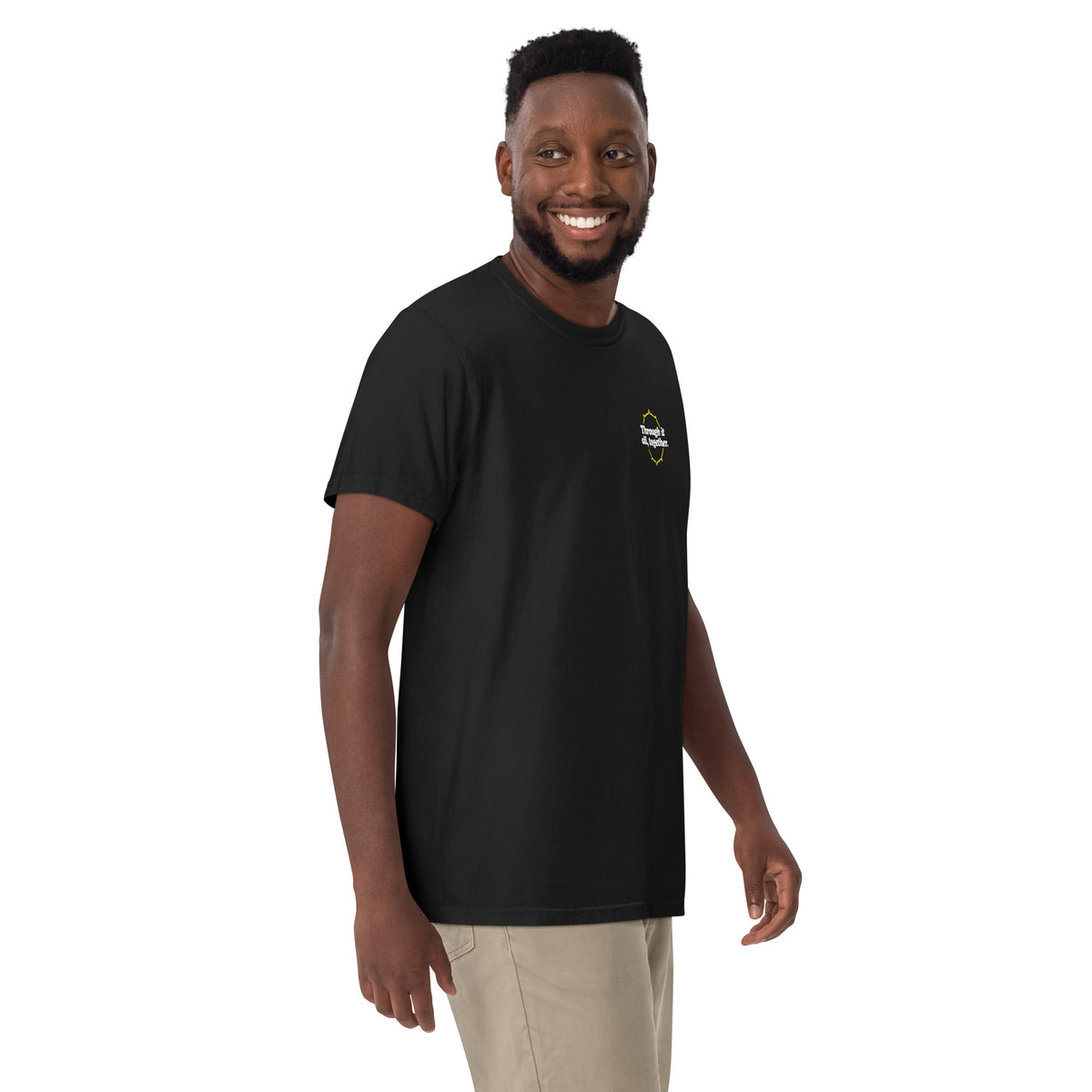Black heavyweight T-shirt on model, small chest logo