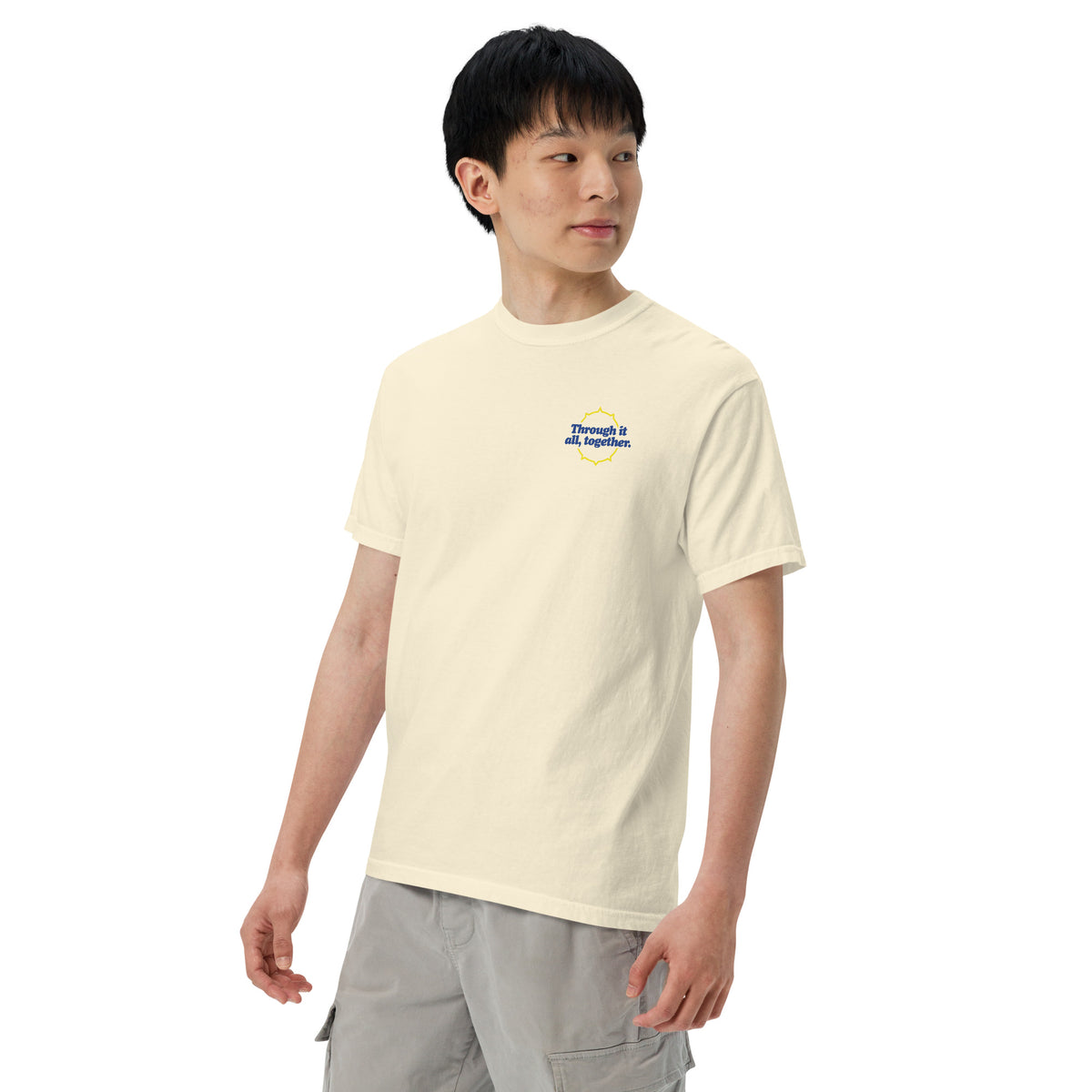Heavyweight T-shirt in light ivory with small blue front logo, front view
