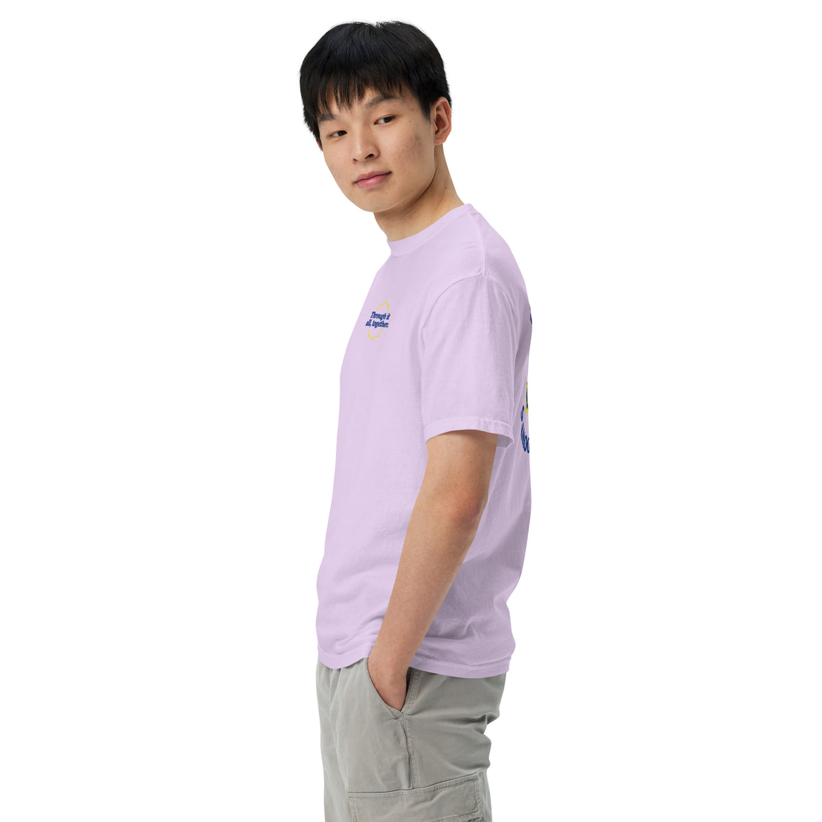 Purple heavyweight t-shirt worn in profile with small sleeve graphic
